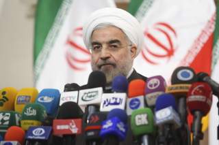 Iranian President Hassan Rouhani speaks with the media during a news conference in Tehran.